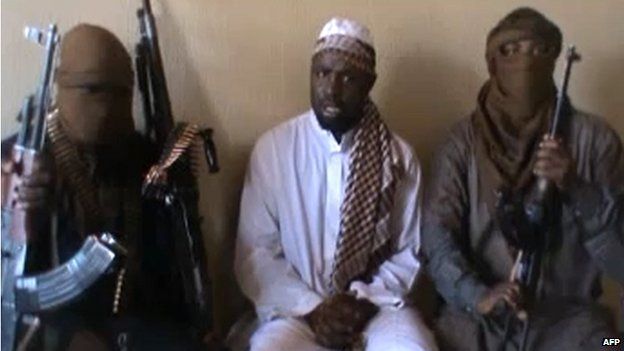 A screengrab taken from a video released on YouTube on 12 April 2012 with Boko Haram leader Abubakar Shekau (C) sitting flanked by militants