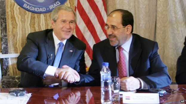 President Bush, left, shakes hands with Iraqi Prime Minister Nouri al-Maliki, right, following their teleconference with members of the U.S. And Iraqi Cabinet members at the U.S. Embassy in Baghdad, Iraq, Tuesday (13 June 2006)