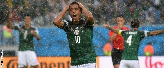Giovani Dos Santos shows his frustration at having a goal disallowed against Cameroon