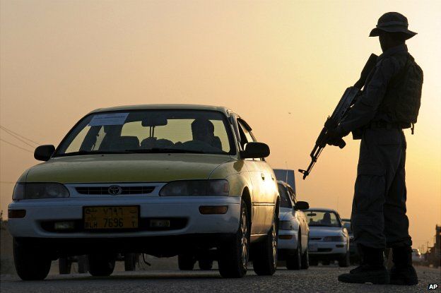 Afghanistan security forces stand guard in a street in Mazar-i-Sharif, north of Kabul - 13 June 2014