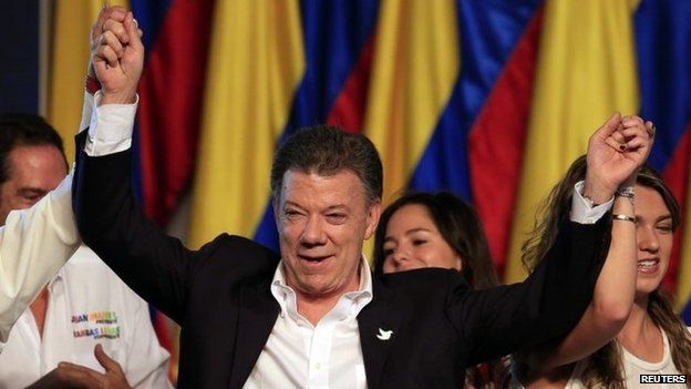 Juan Manuel Santos celebrates victory