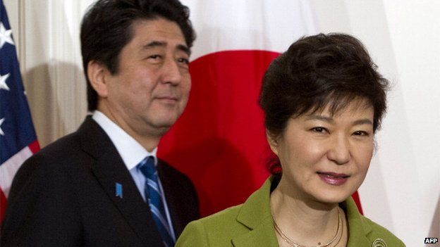 South Korean President Park Geun-hye and Japanese Prime Minister Shinzo Abe arrive for a trilateral meeting with the US presidentat the US ambassador's residence in The Hague on 25 March, 2014