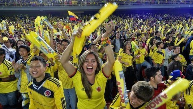 Supporters of the Colombian national football team cheer during the farewell to the squad