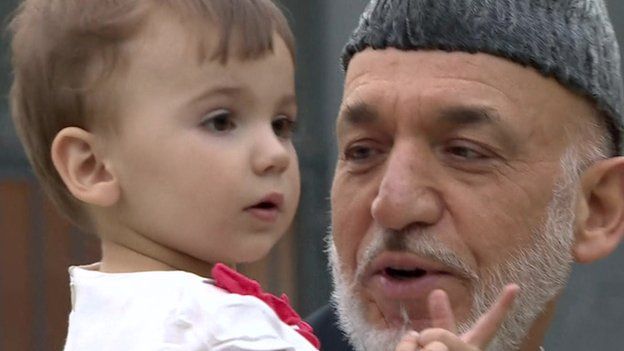 Hamid Karzai with a member of his young family