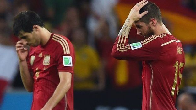 Spain's players cut dejected figures after their World Cup exit