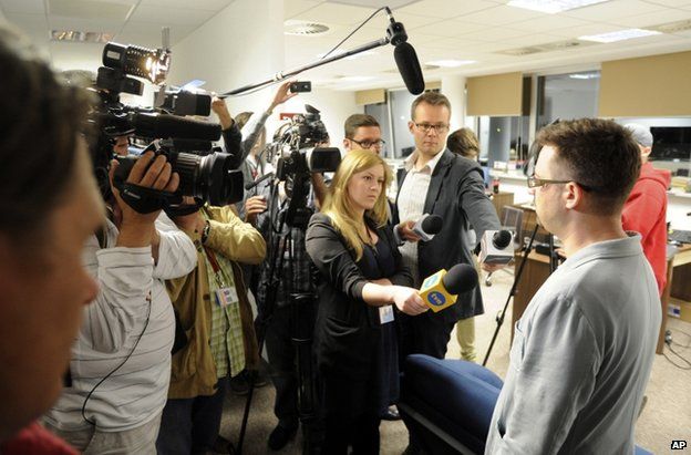 Wprost journalist Marcin Dzierzanowski briefs media at the magazine's offices in Warsaw, 18 June