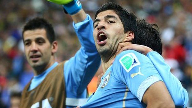 Luis Suarez celebrates Uruguay's victory over England