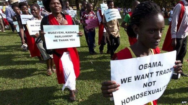 Anti-homosexuality activists march through the streets of Ugandan capital, Kampala, on 31 March 2014 in support of the government's stance against homosexuality