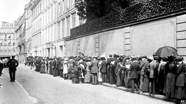 Tourists queue outside the British Consulate for permits to leave Paris.
