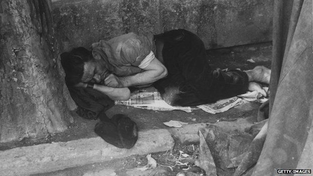 Sleeping man on street of Paris