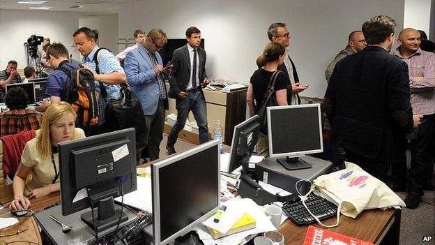 Journalists gathered at the Wprost office in Warsaw to record the raid - 18 June 2014