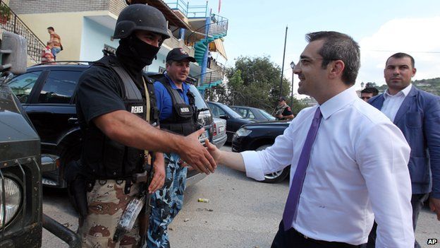 Albanian Interior Minister Saimir Tahiri meets police officers in Lazarat on 20 June 2014