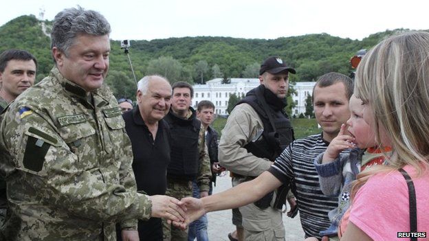 Ukraine's President Petro Poroshenko greets local residents in a town in eastern Ukraine - 20 June 2014