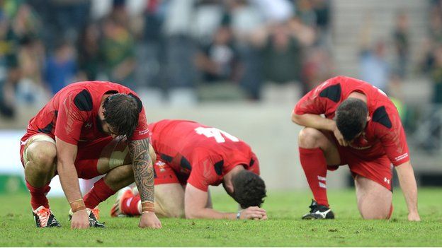 Wales players dejected at the end of the game