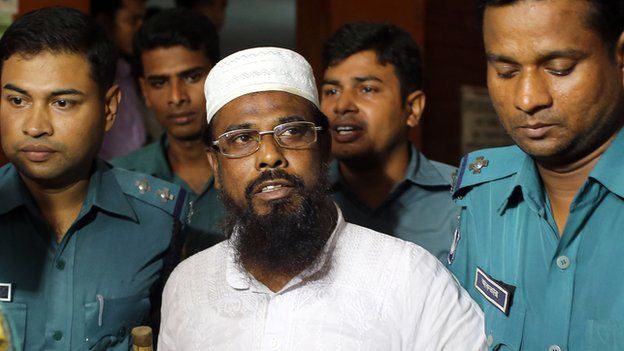 Bangladeshi policeman produce Mufti Abdul Hannan, leader of banned radical group Harkat-ul Jihad al-Islami, at a court in Dhaka, Bangladesh on Monday, 16 June, 2014