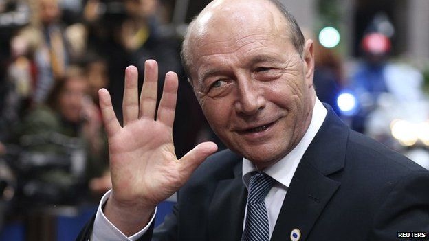 Romania's President Traian Basescu waves as he arrives at an informal summit of European Union leaders in Brussels - 27 May 2014