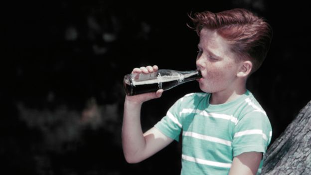 Boy drinking soda