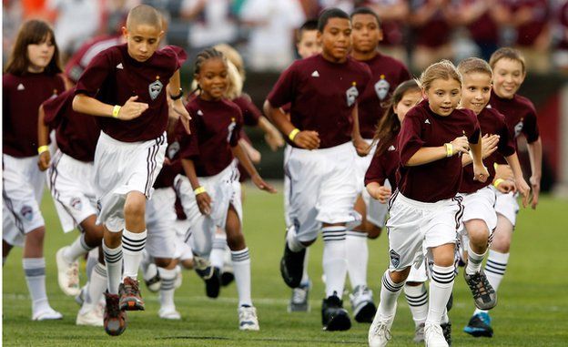 The Colorado Rapids youth soccer player escorts leave the field
