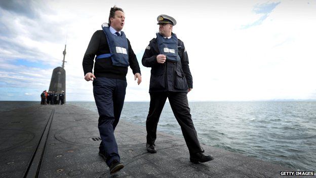 David Cameron with Commander John Livesey aboard HMS Vanguard, 2013
