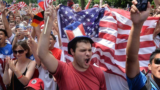 Fans cheer on the US football team during its World Cup match against Germany on 26 June.
