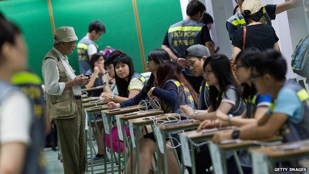 People vote at polling centre for an unofficial referendum on democratic reform in Hong Kong on June 29, 2014 in Hong Kong, Hong Kong.