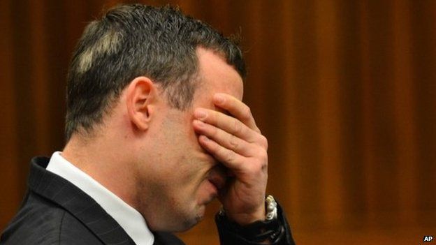 Oscar Pistorius listens to evidence in court in Pretoria, South Africa, on 30 June 2014
