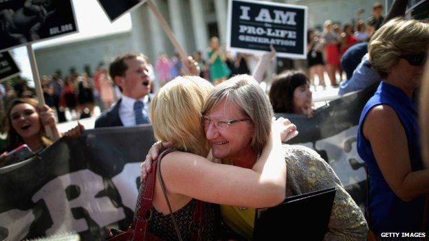Anti-abortion advocates hugged in front of the Supreme Court on 30 June 2014