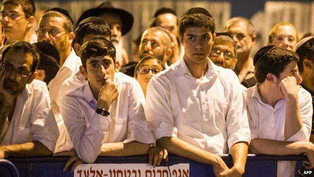 Israelis gather in Elad, outside the house of Eyal Yifrach, one the three missing teenagers, on 30 June 2014