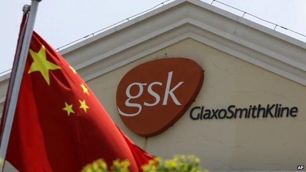 File photo: A Chinese flag is hoisted in front of a GlaxoSmithKline building in Shanghai, China, 24 July 2013