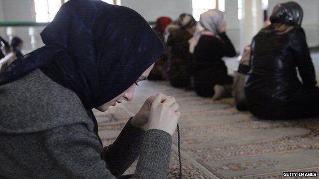Muslim women pray inside a Moscow mosque on 30 March 2010.