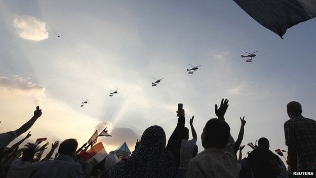 Egyptian military helicopters fly above Tahrir Square on July 1 2013