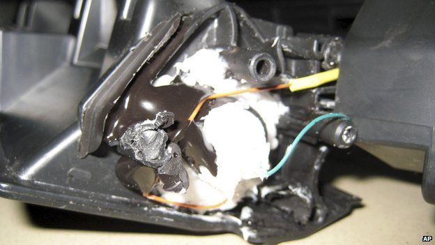 Parts of a printer with explosives inside its toner cartridge, found in a package by Dubai police (30 October 2010)