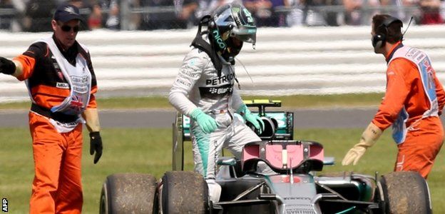 Nico Rosberg climbs out of his car