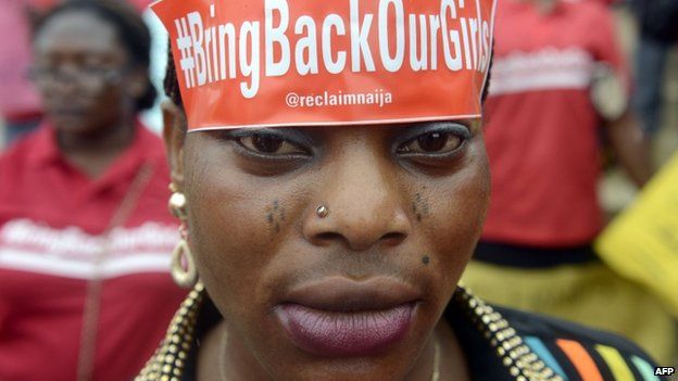 A woman with a sticker on her head bearing the slogan "Bring back our girls" marches for the release of the more than 200 abducted Chibok schoolgirls - Lagos, Nigeria (29 May 2014)