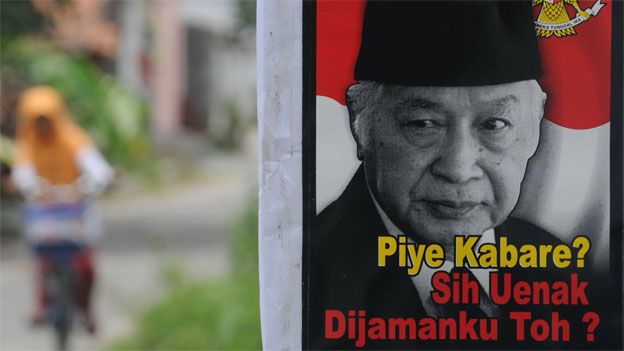 A poster bearing the portrait of Suharto with a slogan 'How are you bro? Still better in my time, no?' is displayed in Karanganyar town in central Java, March 9, 2014