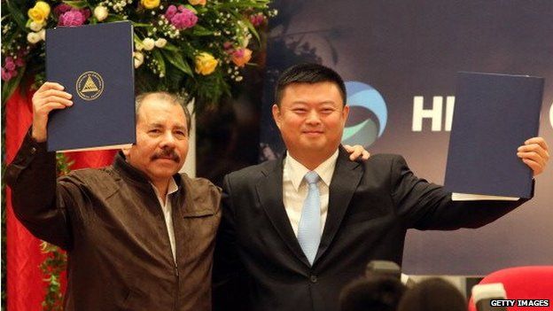 Nicaraguan President Daniel Ortega stands next to Wang Jing during the framework agreement for the construction of the Inter-oceanic Grand Canal in Managua on 14 June, 2013