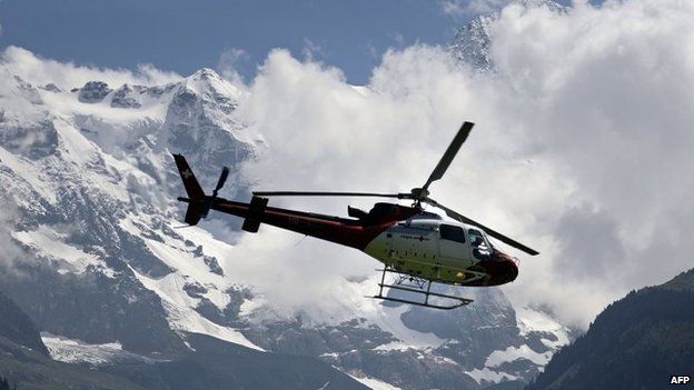 File photo: A helicopter of the Zurich-based helicopter company, Rega (Swiss Air-Rescue) lands at the air rescue base of Lauterbrunnen in the Bernese Oberland region of central Switzerland, 12 July 2007
