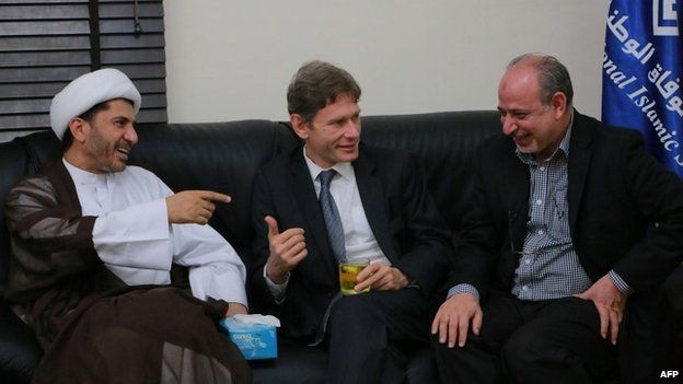 Malinowski with Bahrain's Al-Wefaq opposition group leader Sheikh Ali Salman (left)