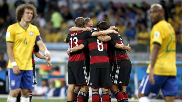 Germany players celebrate while David Luiz looks on