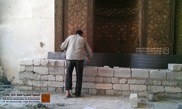 A man building a protective wall
