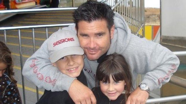 San Francisco Giants baseball fan Bryan Stow and his two children in April 2011 before the attack