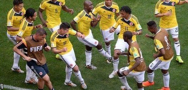 Colombia players celebrate a goal at the 2014 World Cup