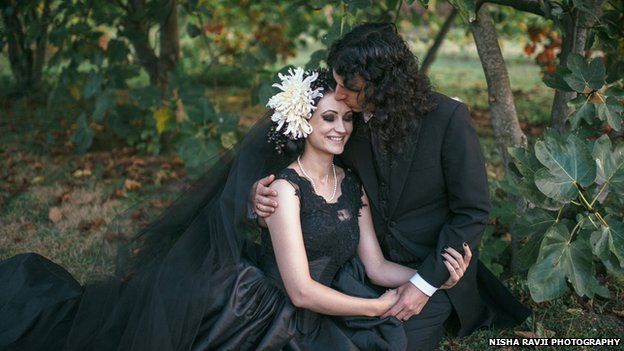 Bride and groom in black gothic-style wedding clothes