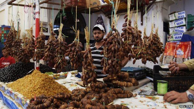 A Tunisian vendor displays his dates on the first day of the Muslim holy fasting month of Ramadan, in a market in Tunis on 29 June 2014
