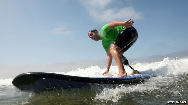 Amputee surfer Ryan West on his surfboard