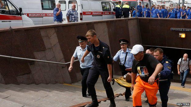 Emergency services carry injured passenger out of Moscow metro tunnel on stretcher (15 July)