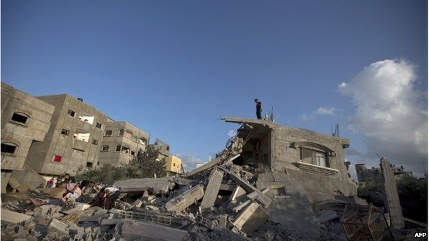 Palestinian at a destroyed building following an Israeli military strike on Beit Lahya on 15 July.