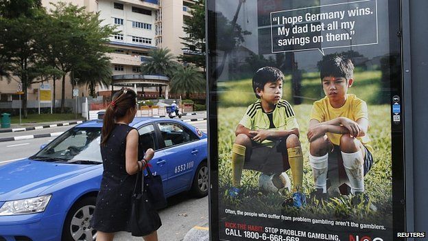 World Cup anti-gambling advertisement at taxi stand in Singapore. 9 July 2014