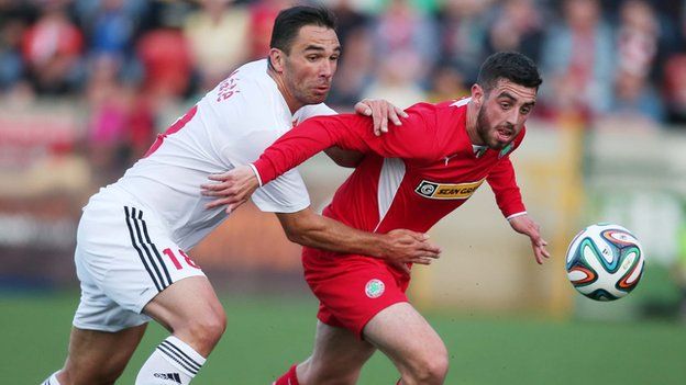 Cliftonville striker Joe Gormley attempts to burst away from Debrecen defender Peter Mate in Tuesday's game