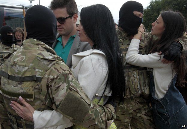 Young women say goodbye to Azov Battalion fighters in Kiev, 23 June